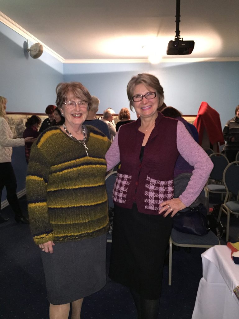 Two happy knitters try on designs from the A/W issue of my magazine.